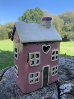 pink ceramic tea lighthouse with an opening at the back to secure a tea light or LED light in.