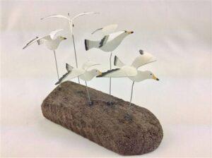 Flying Seagulls on Driftwood